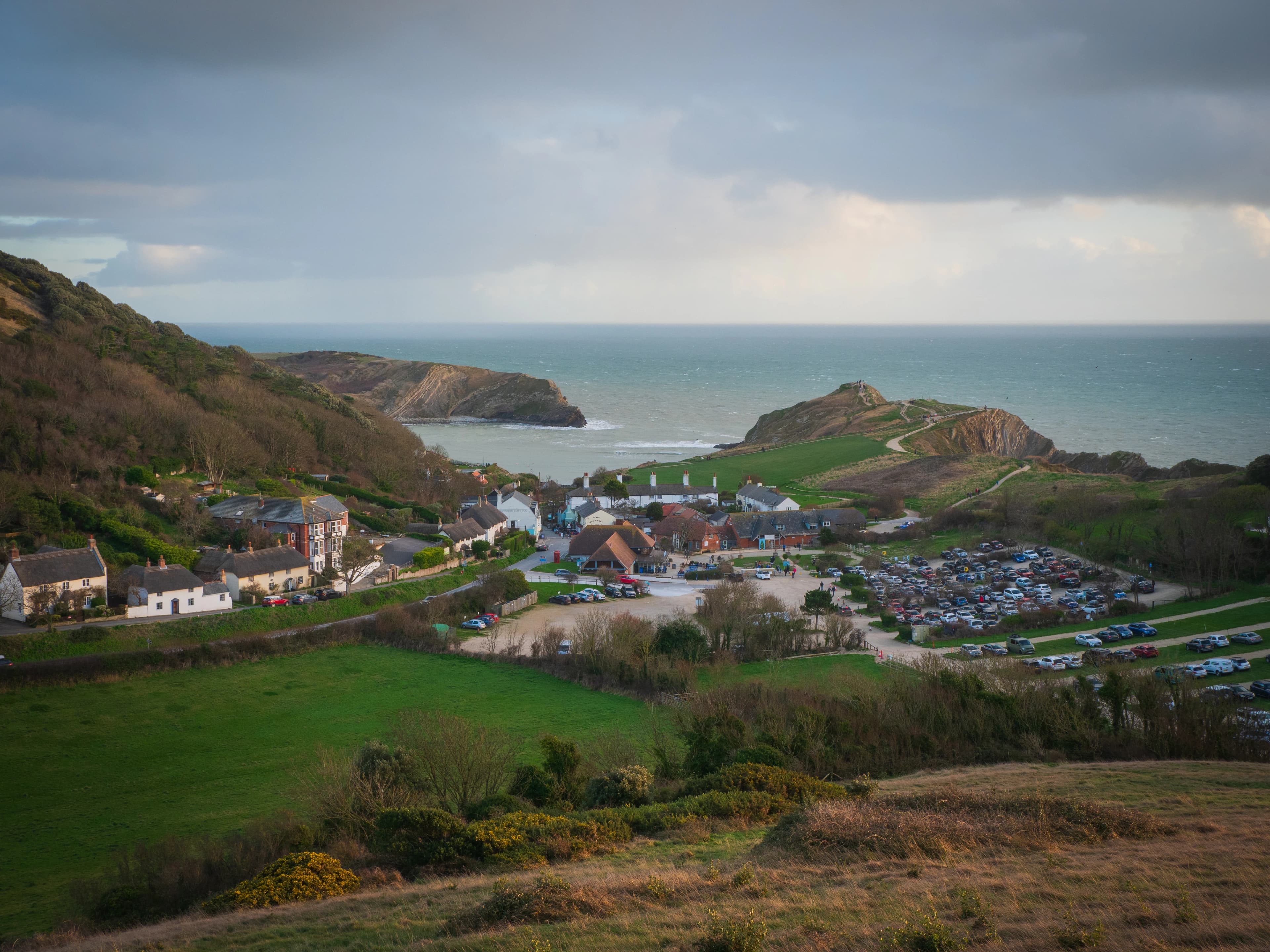 a view of a small town by the ocean