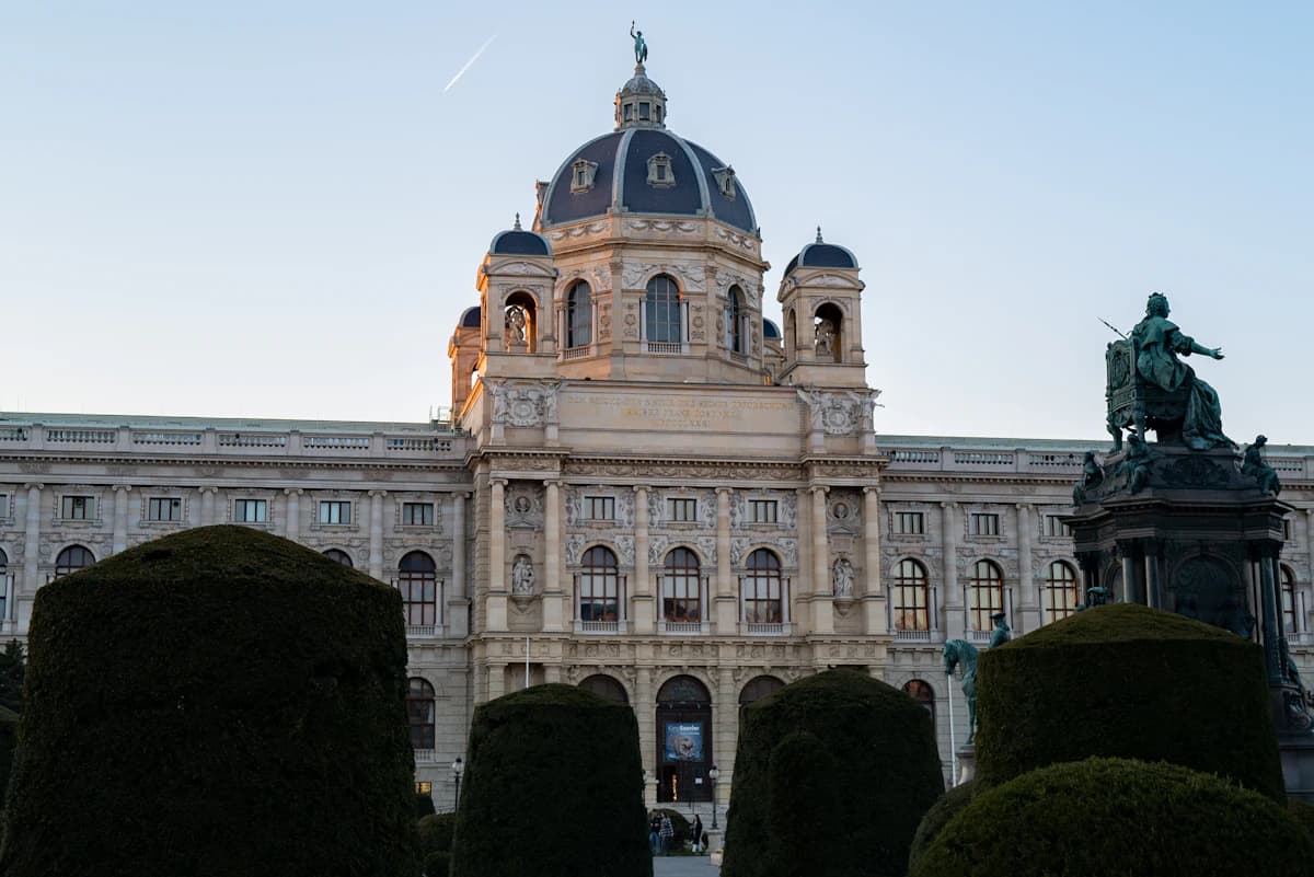 a large building with a statue in front of it