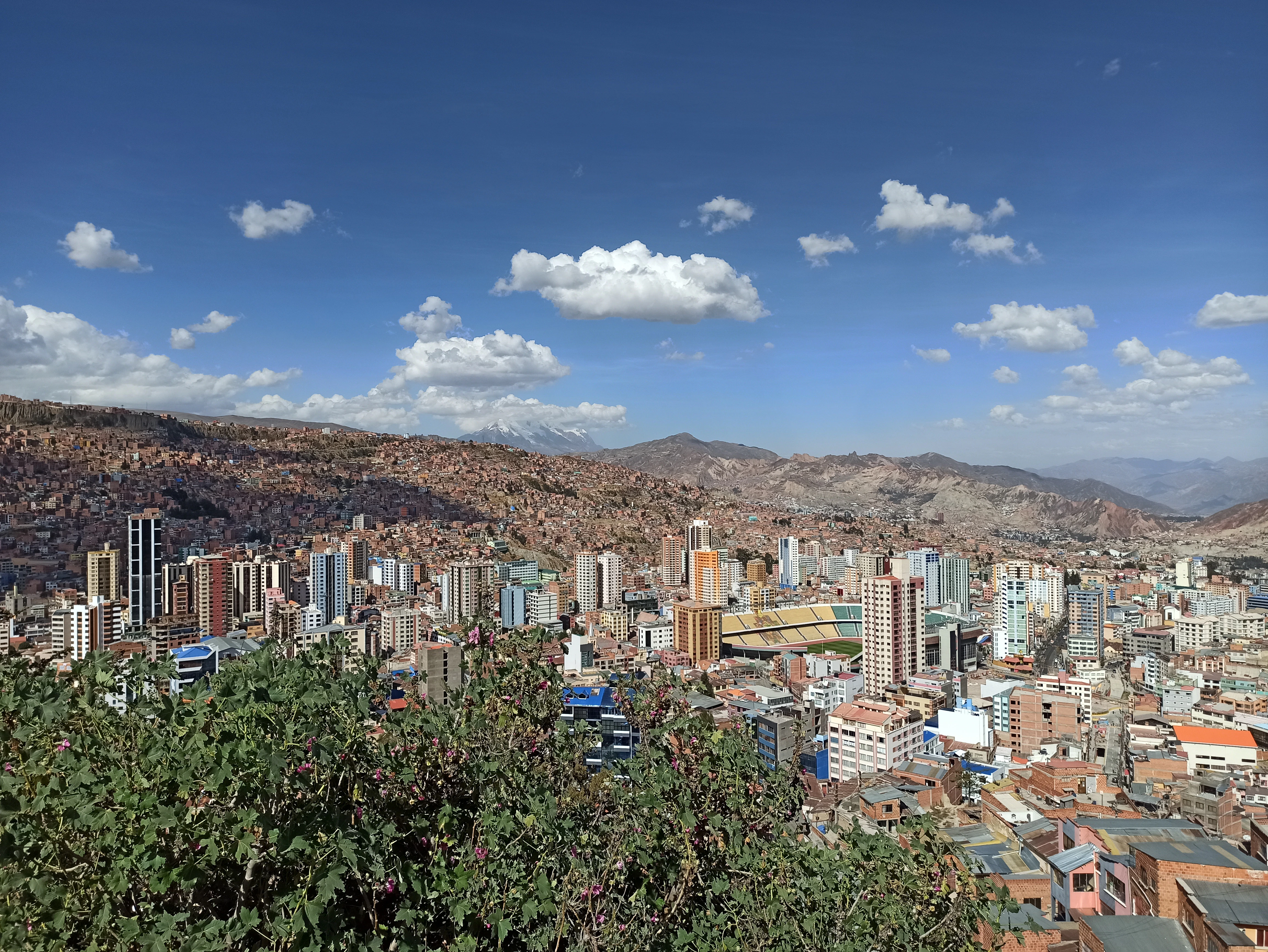 a view of a city with mountains in the background