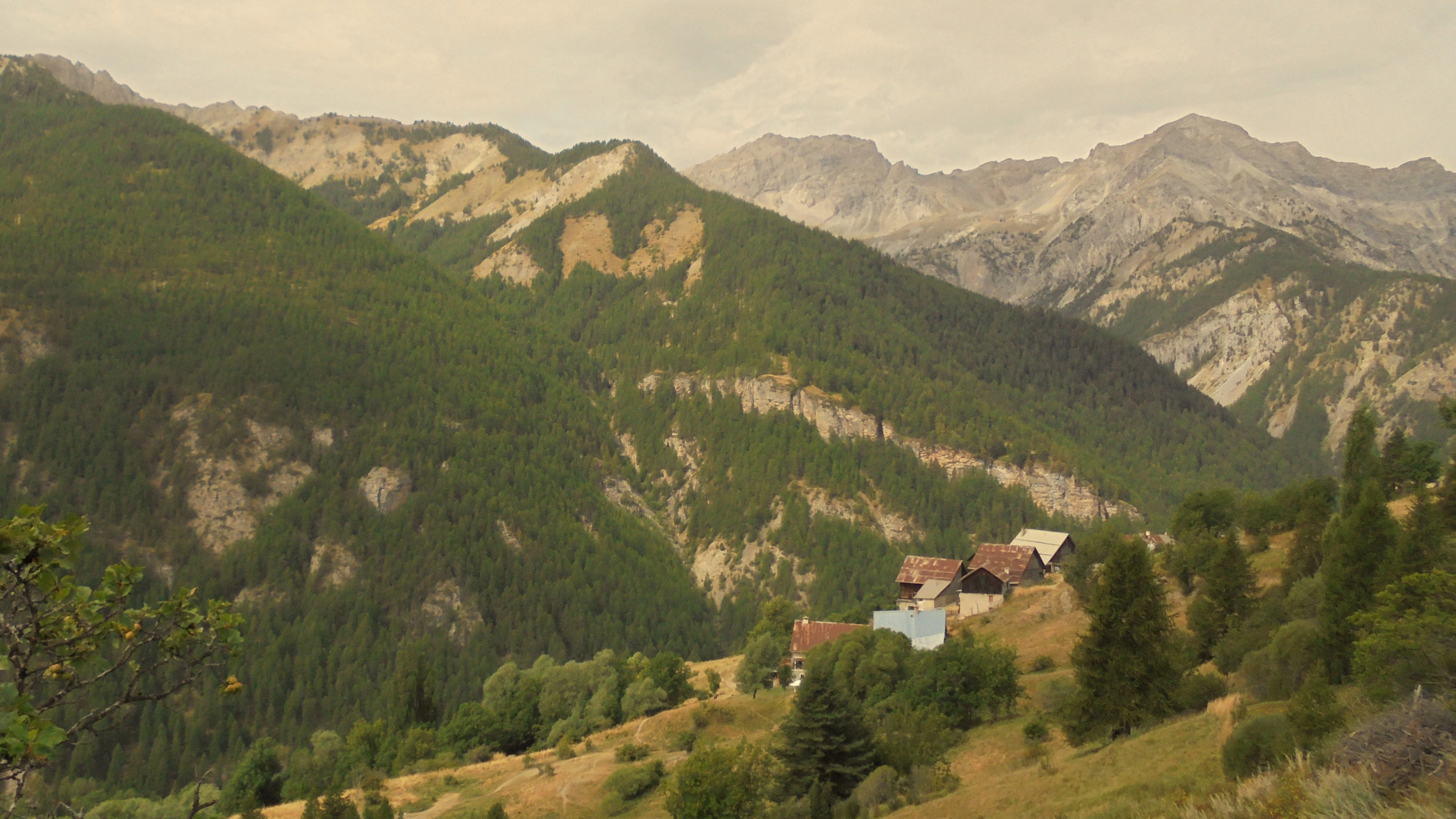 a house in the middle of a mountain range