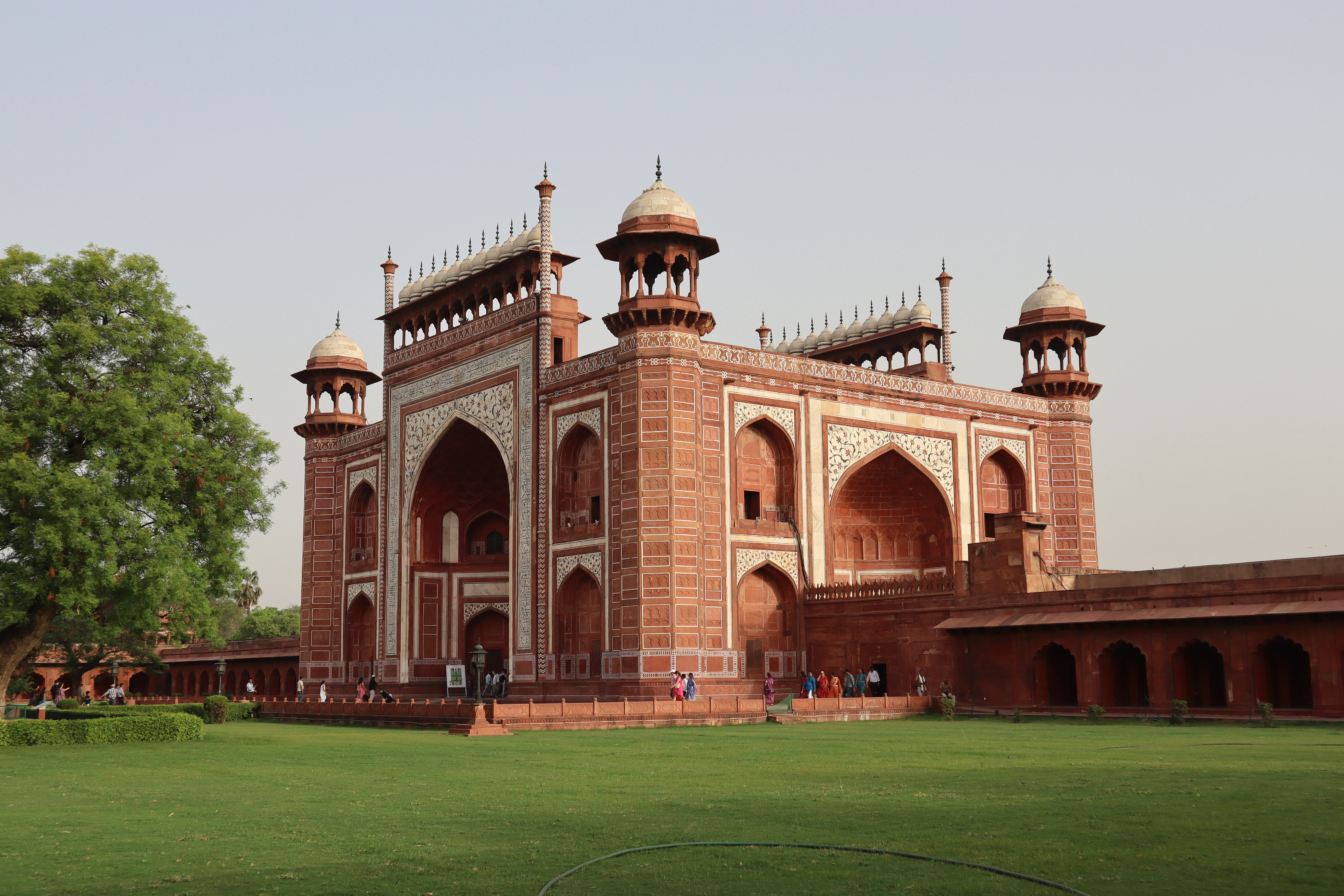 a large brick building with two towers on top of it