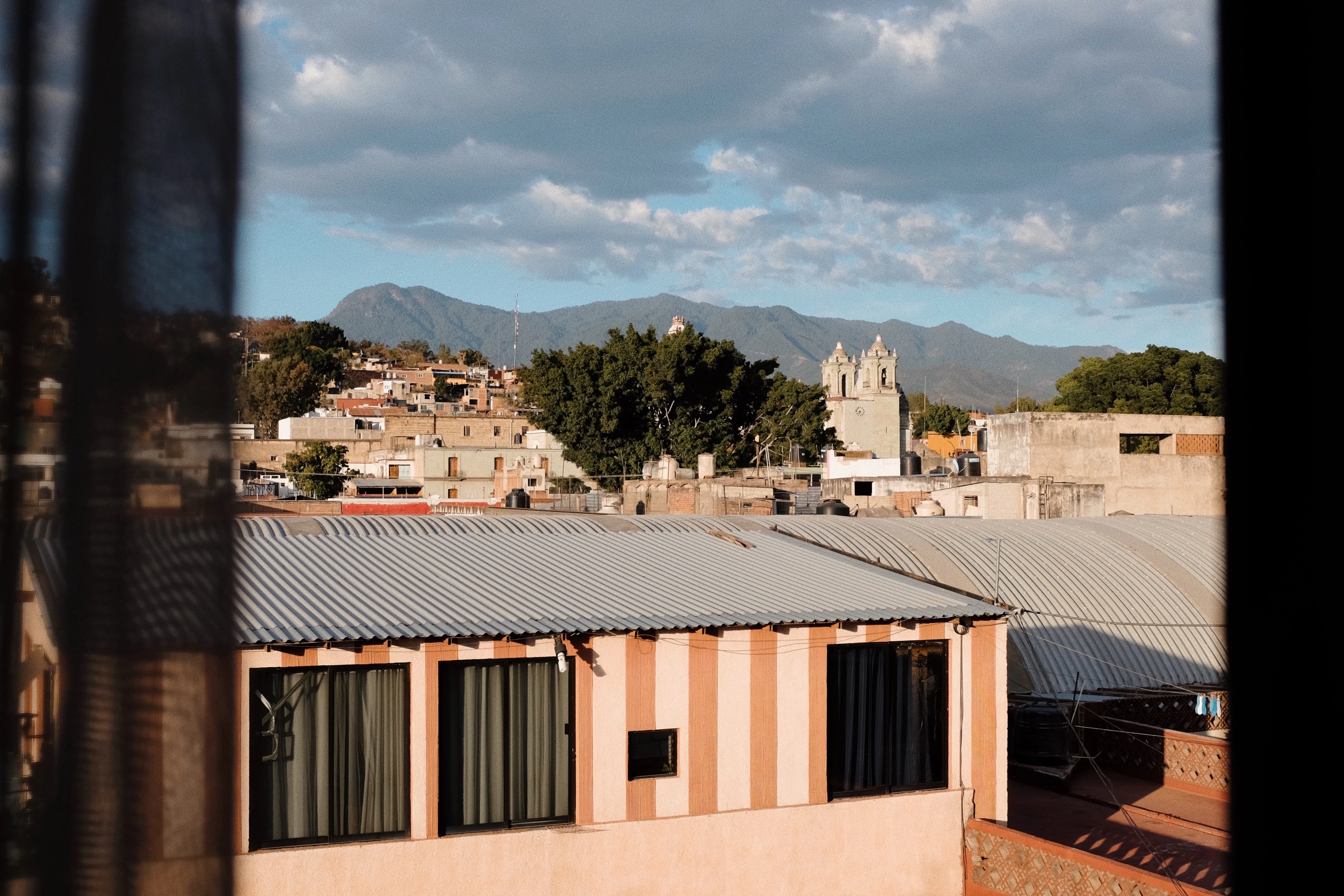 a view of a city with mountains in the distance