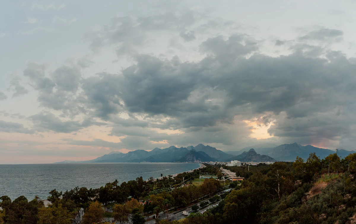 a road next to a body of water