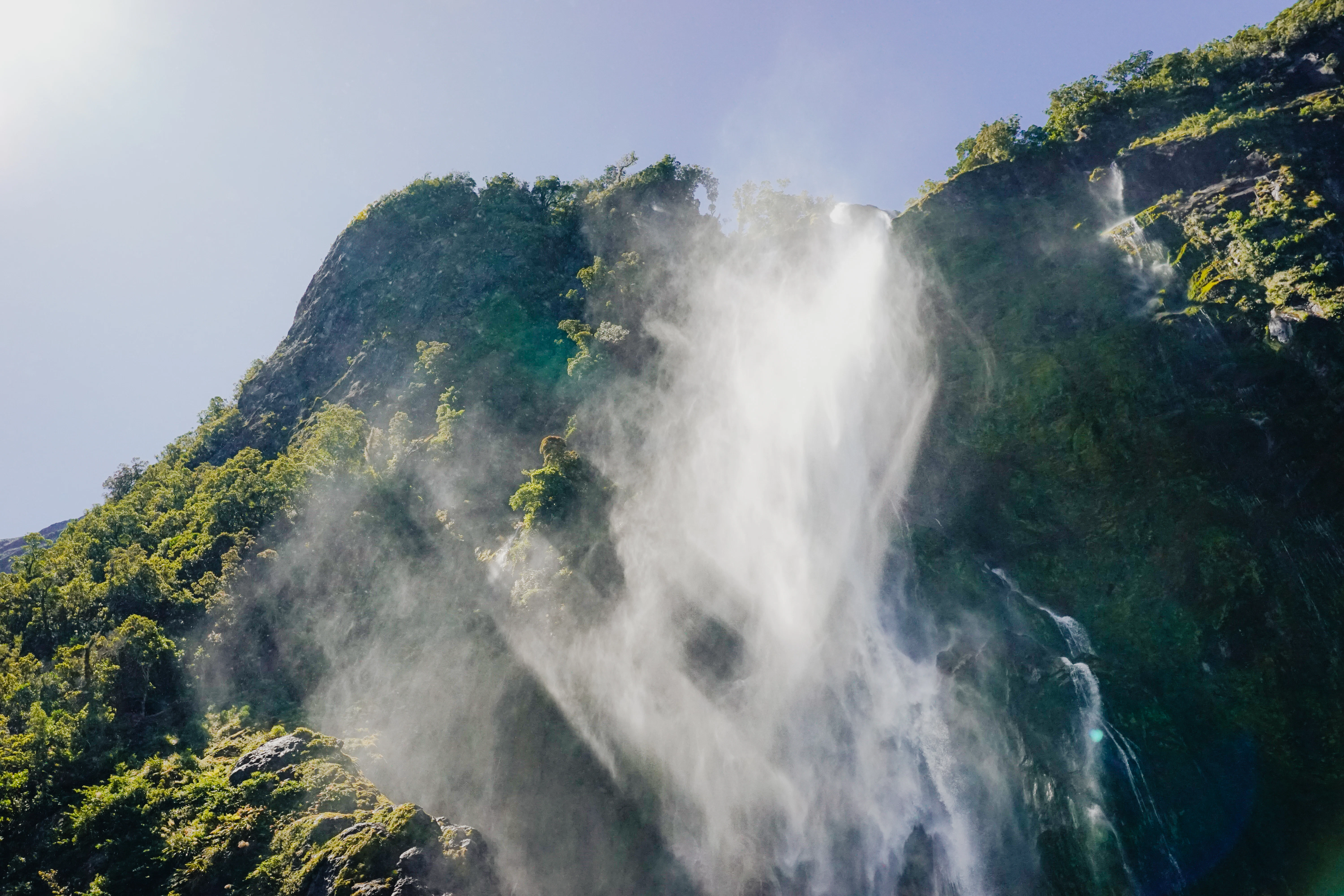 A large waterfall with water coming out of it