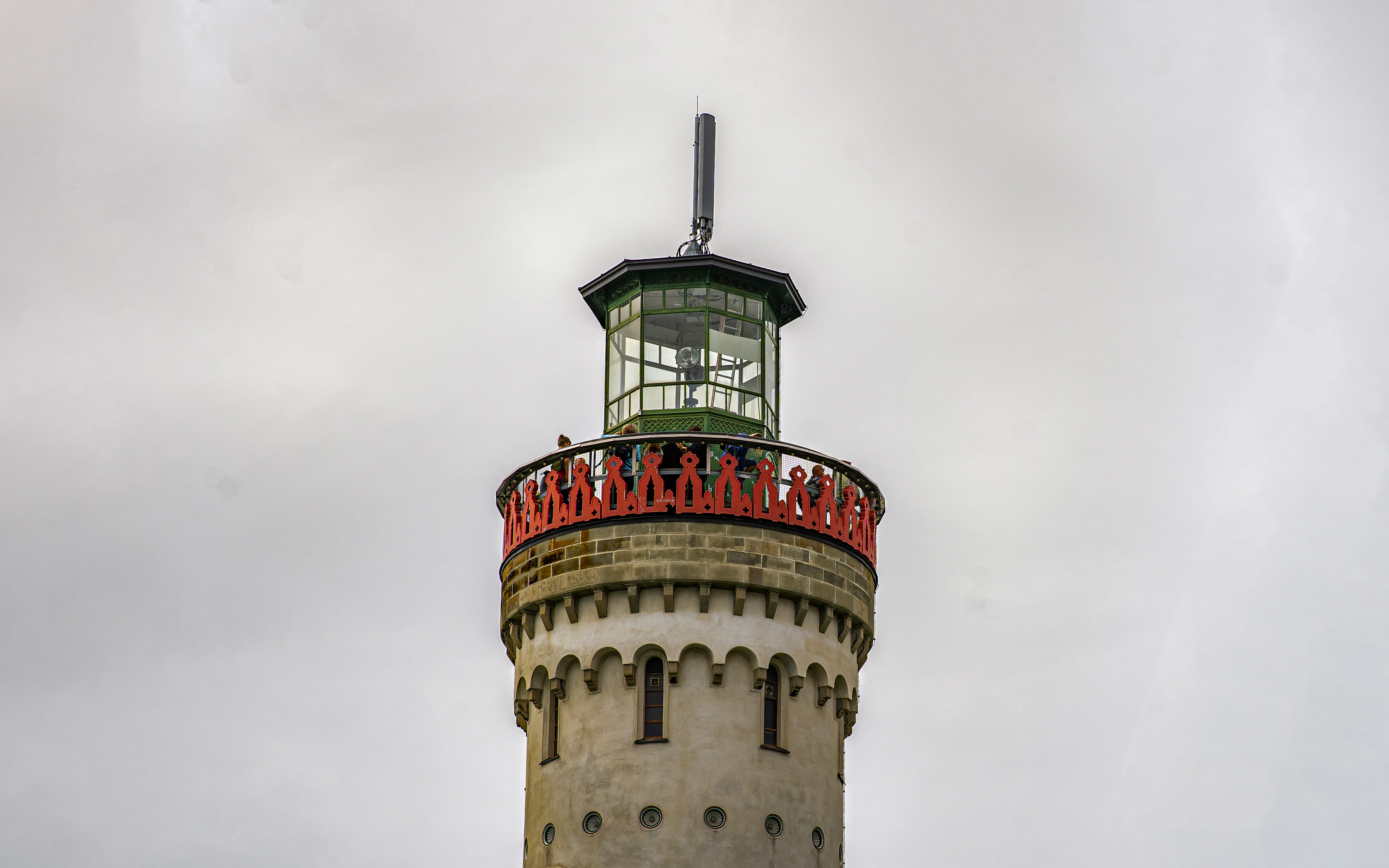 A tall tower with a light on top of it