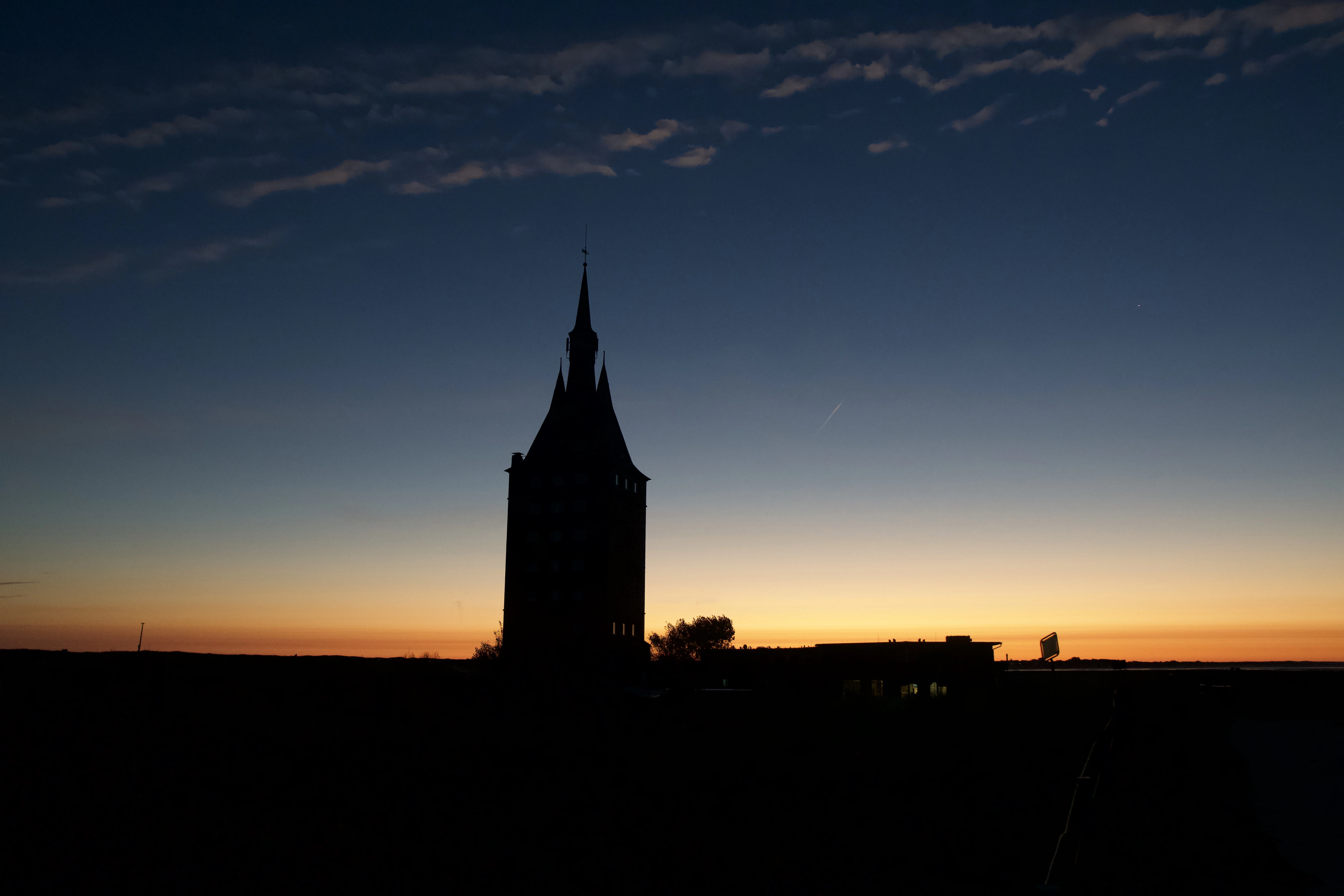 Silhouette of a tower against a twilight sky