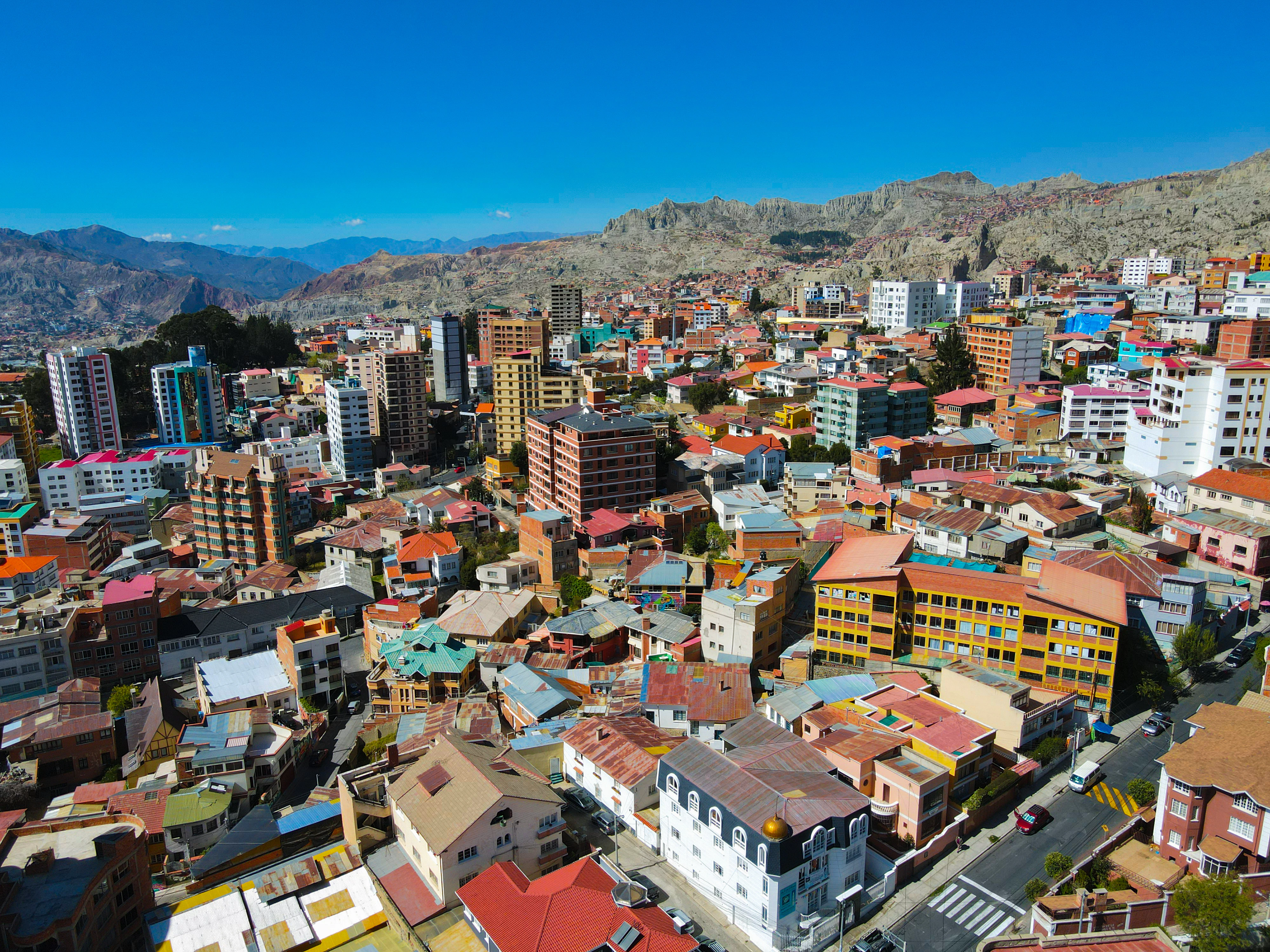 a view of a city with mountains in the background