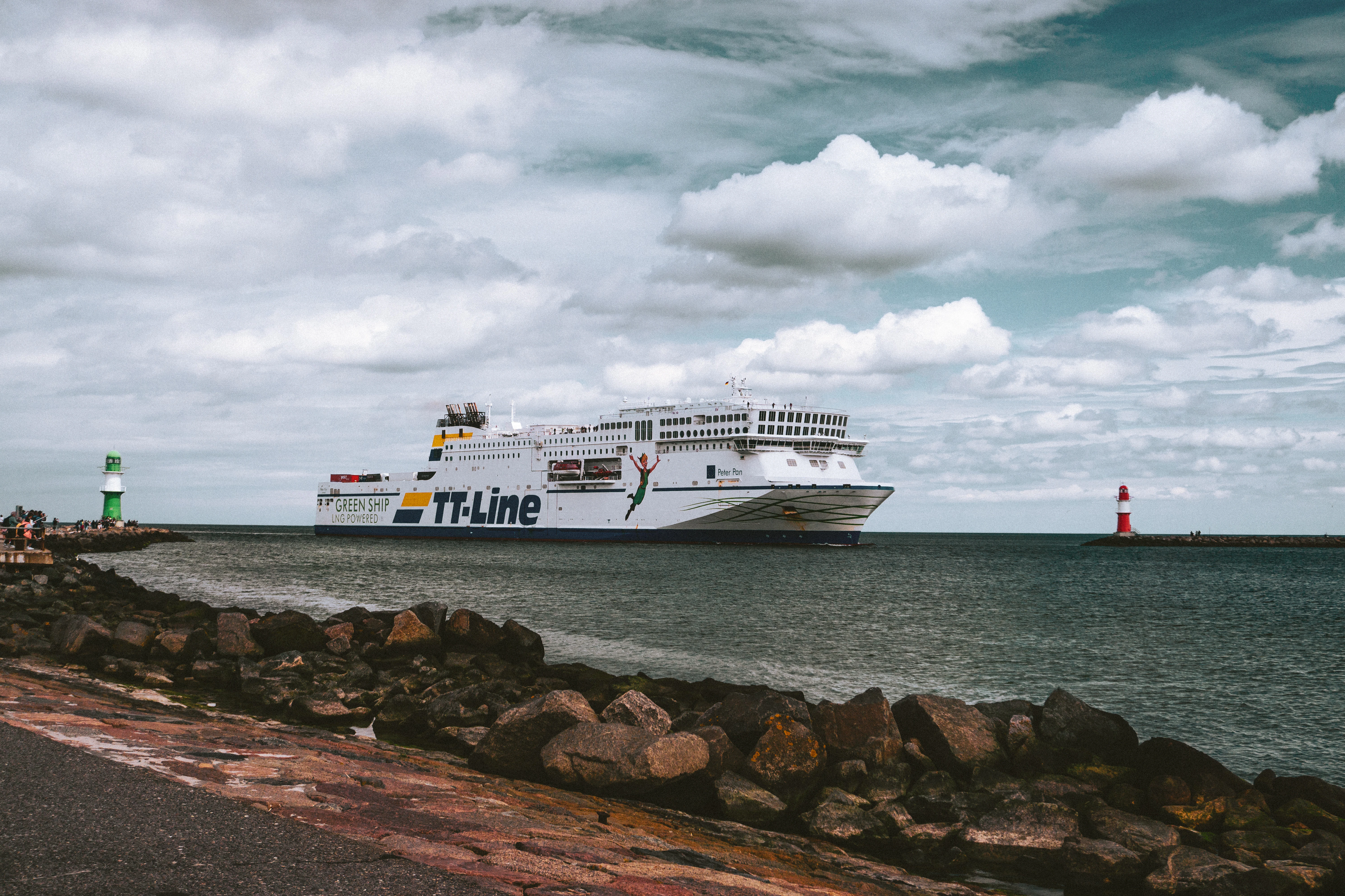a large white boat is in the water