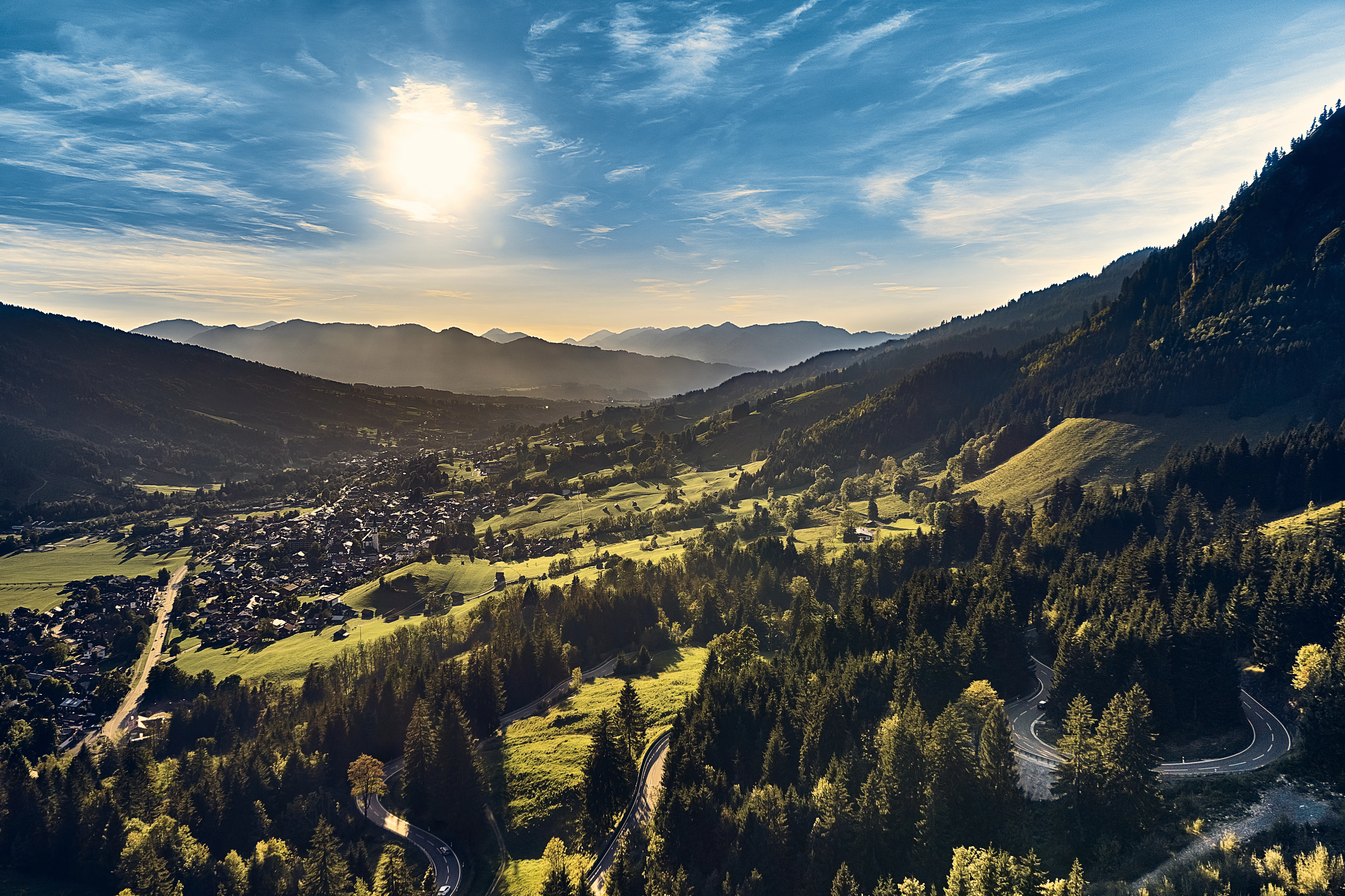 green trees on mountain under blue sky during daytime