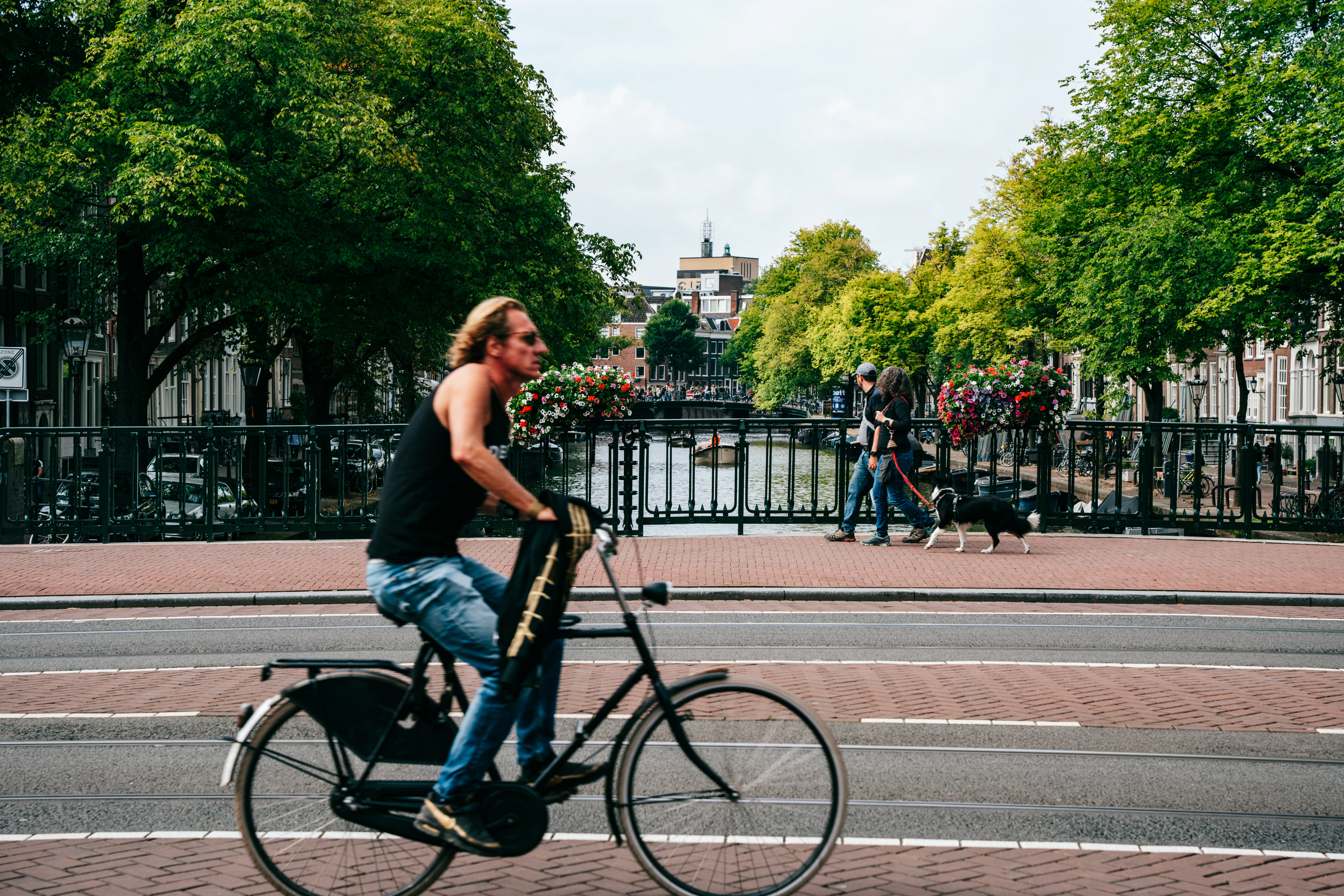 a man riding a bike down a street