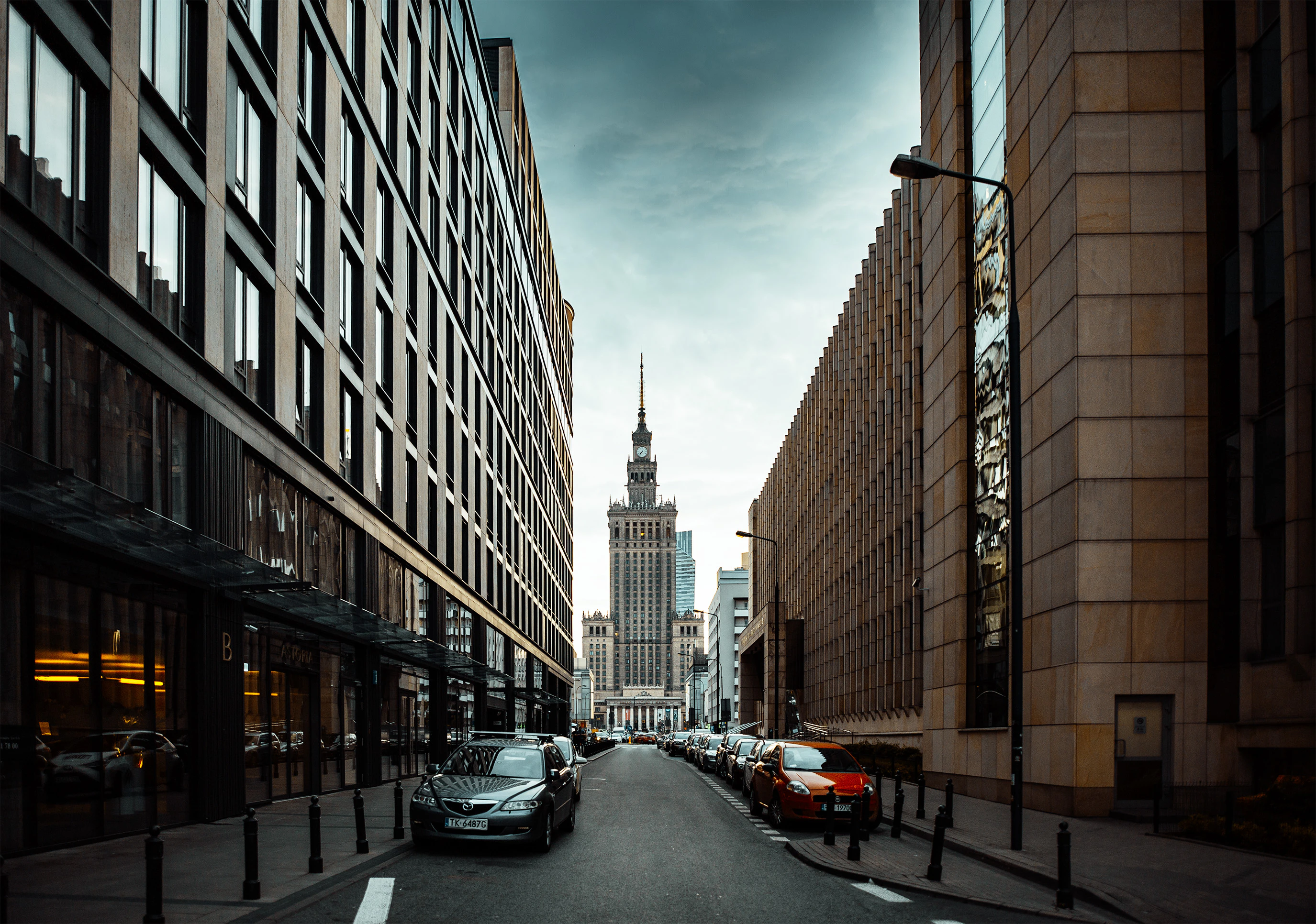 a street with cars and buildings on either side of it