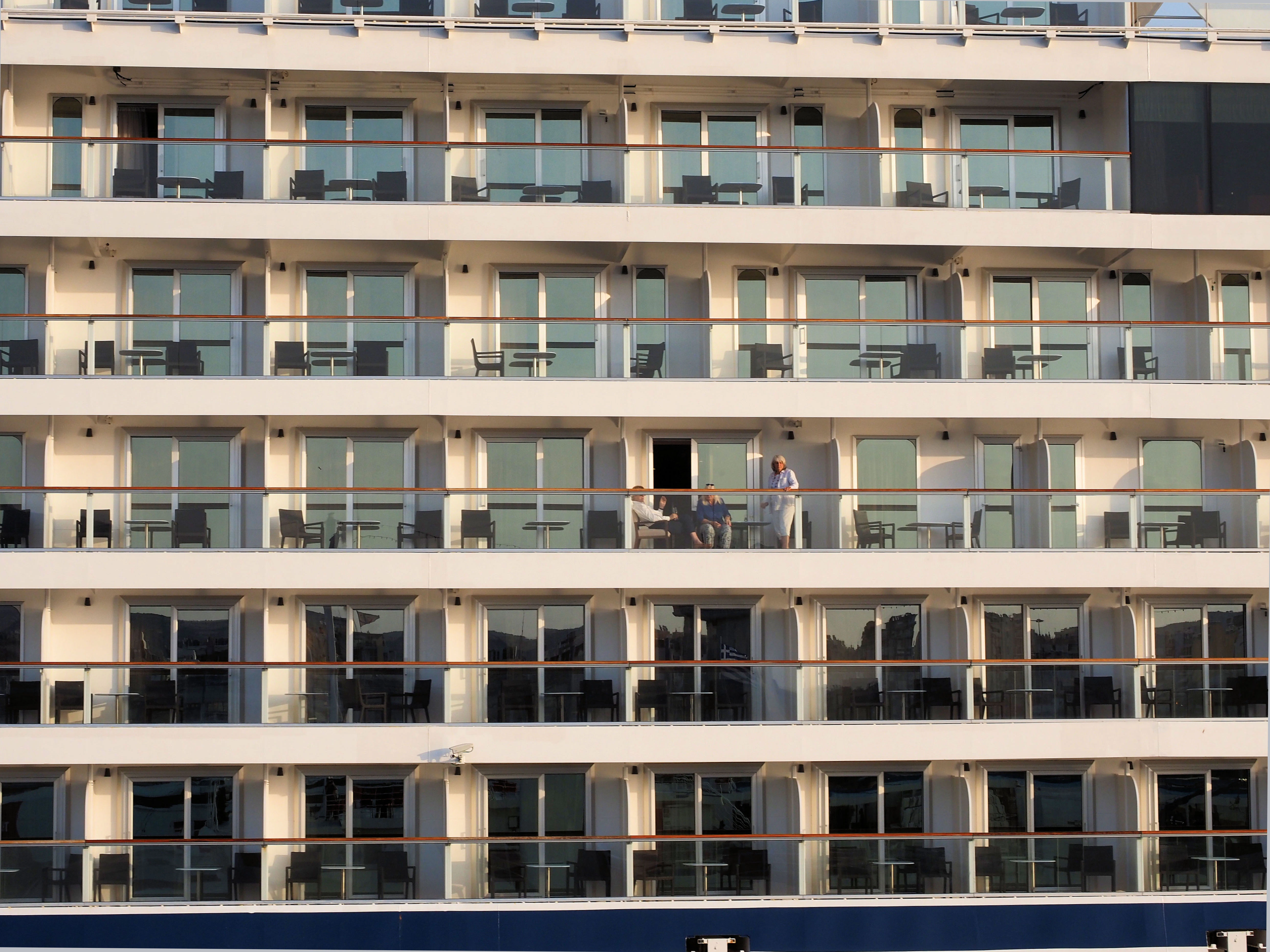Rows of balconies on a modern cruise ship.