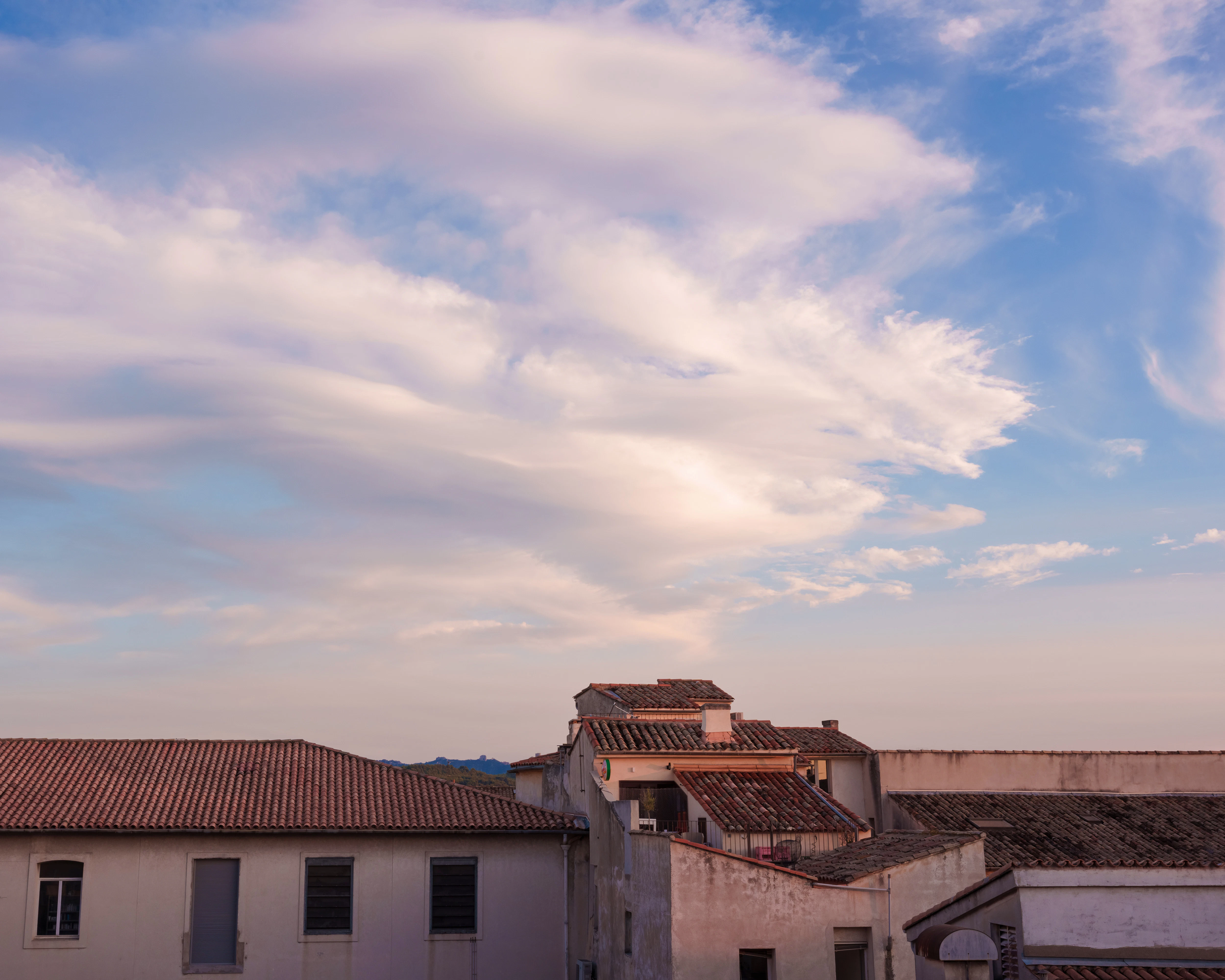 a view of a building with a sky background