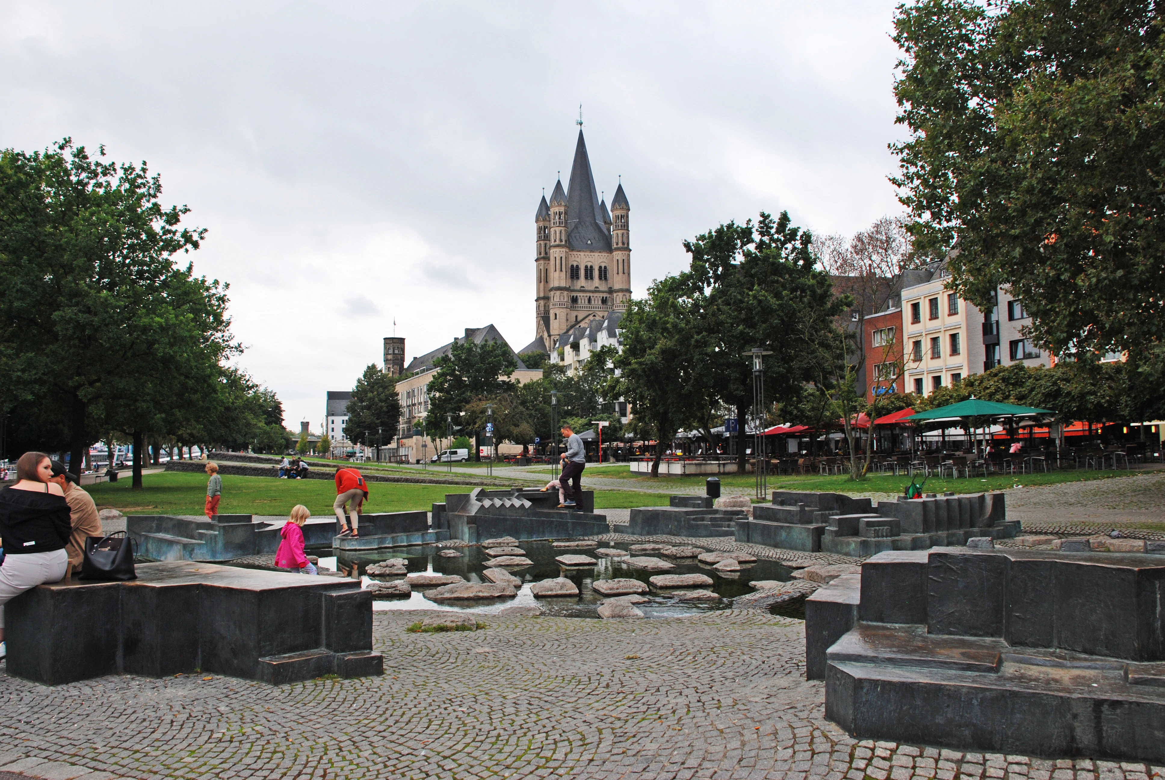 a couple of people that are sitting on a bench