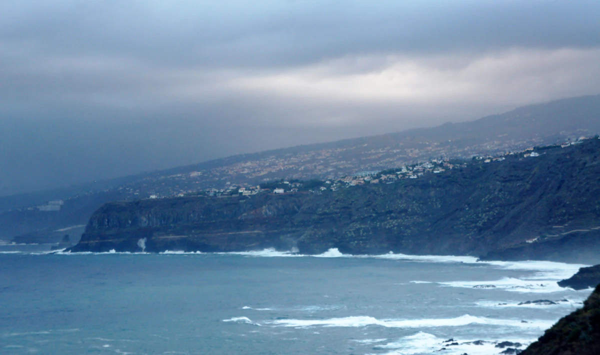 a view of a body of water with a mountain in the background