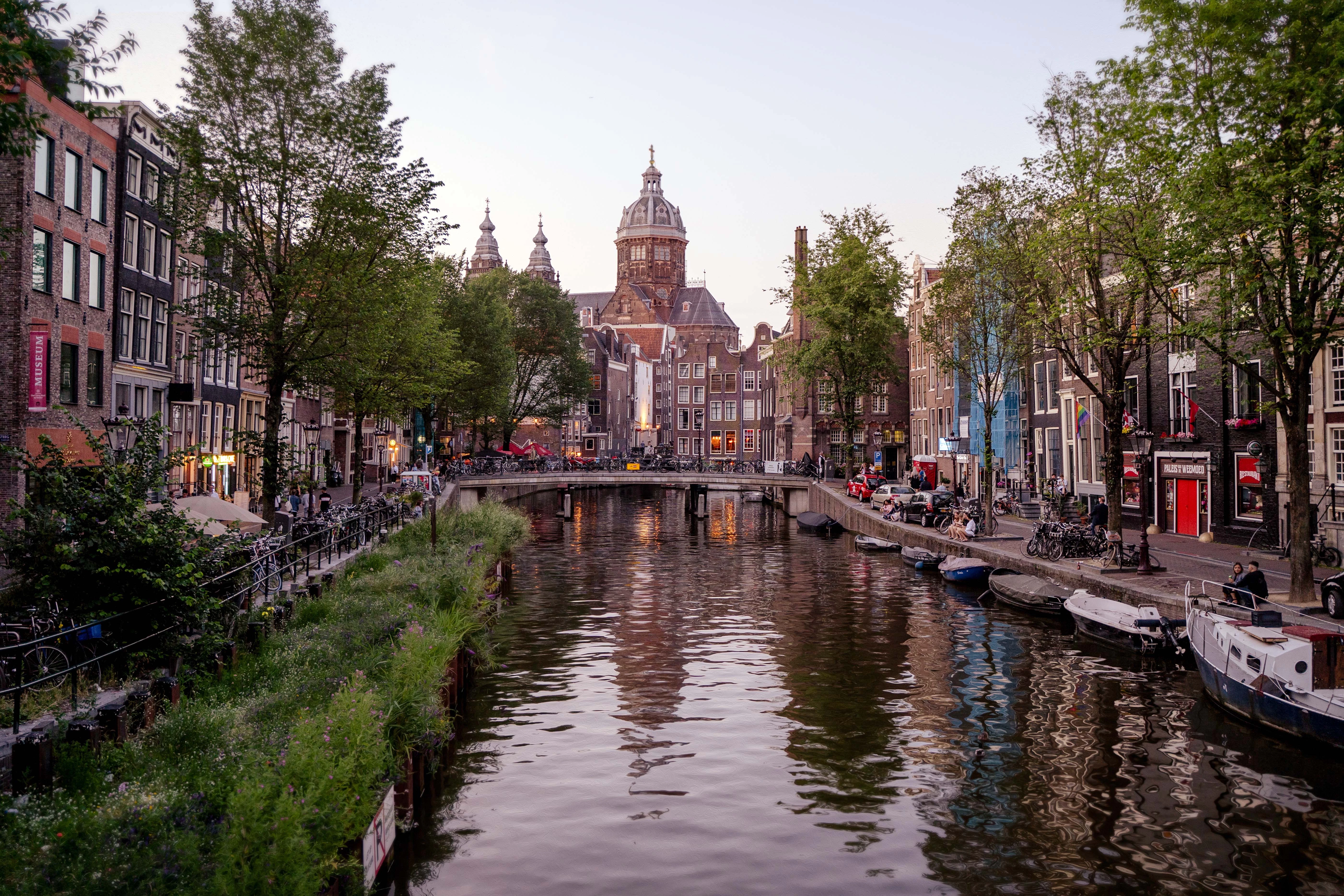 a canal with boats and buildings along it
