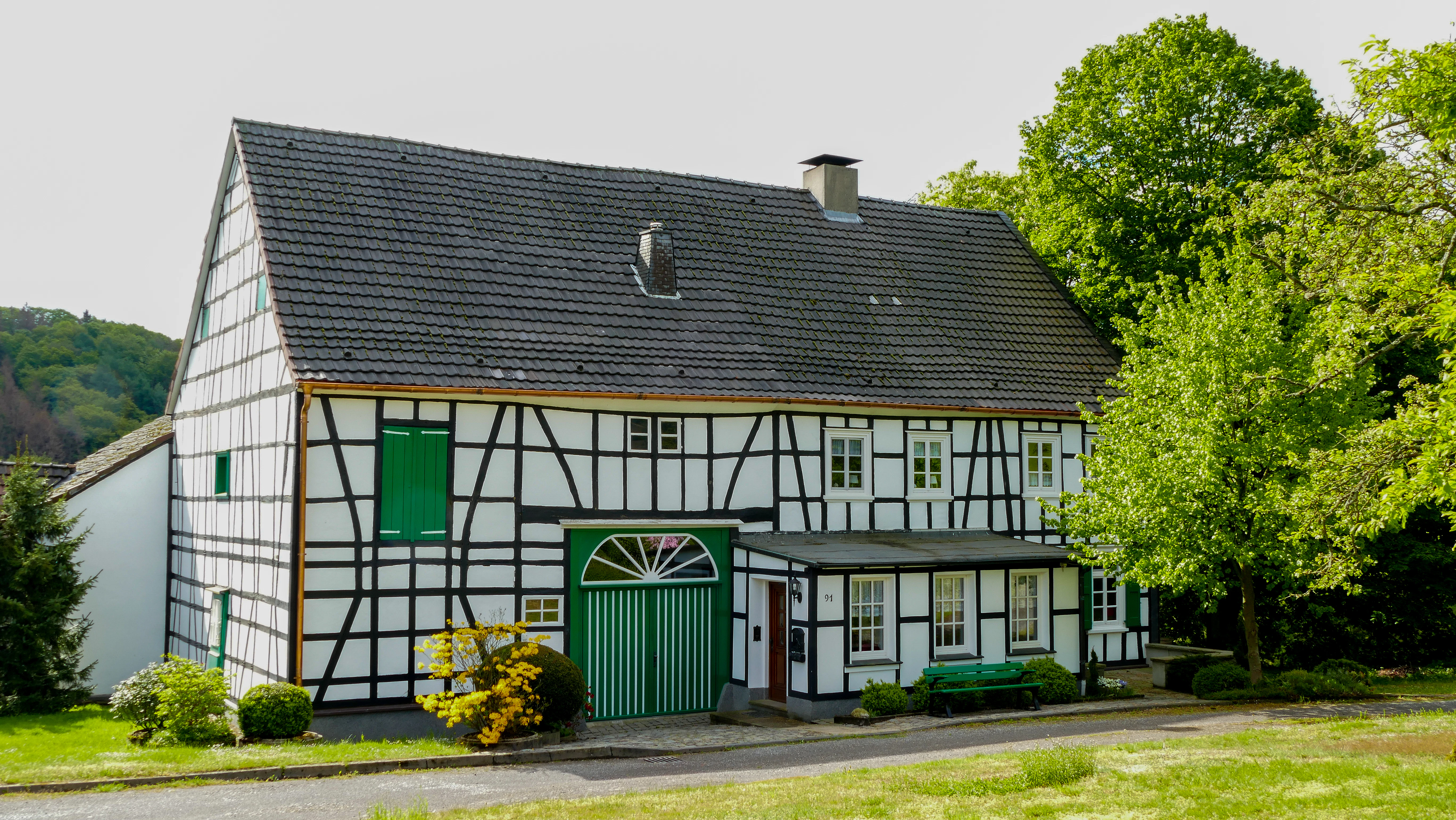green and white wooden house