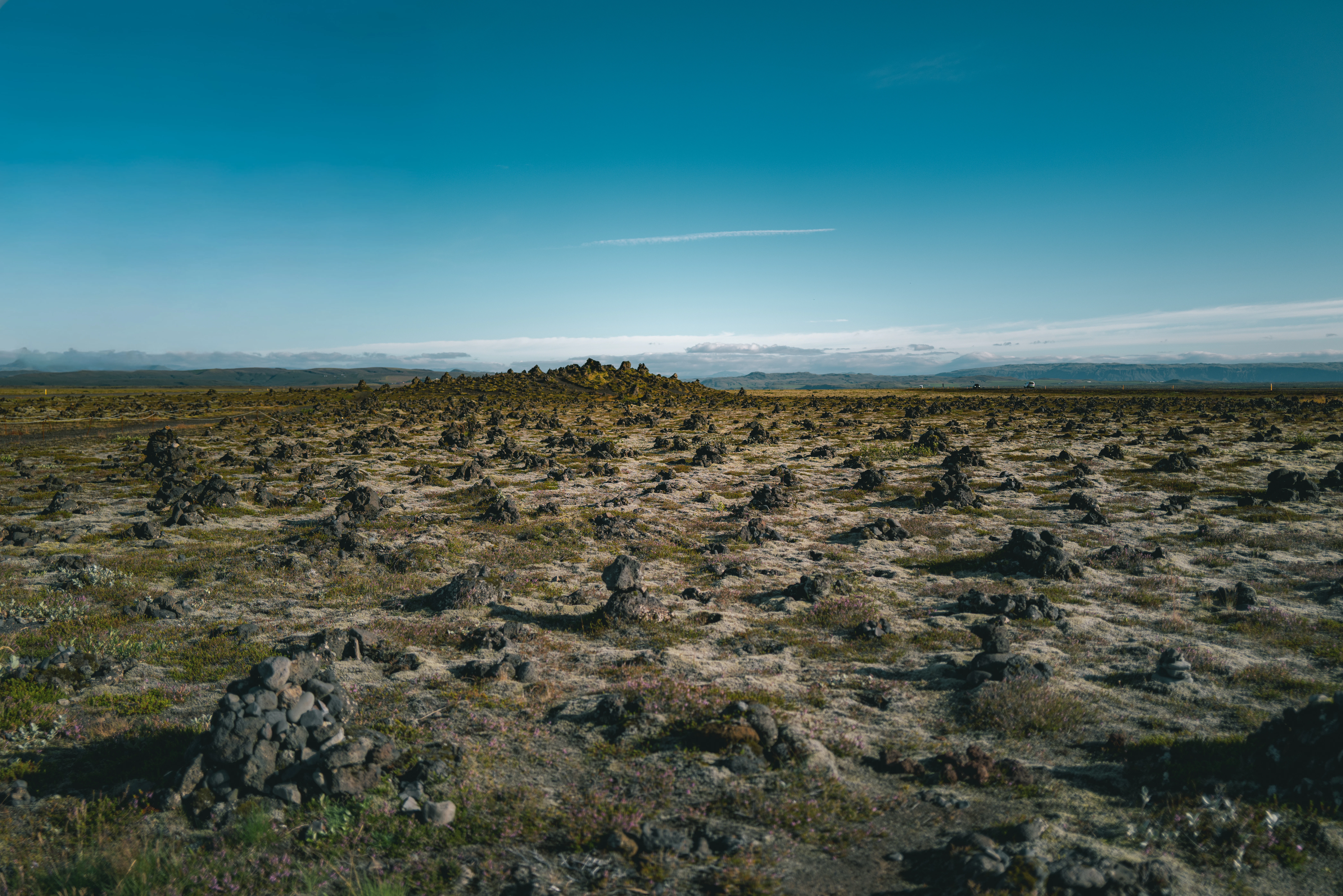 Rocky, barren landscape under a clear blue sky