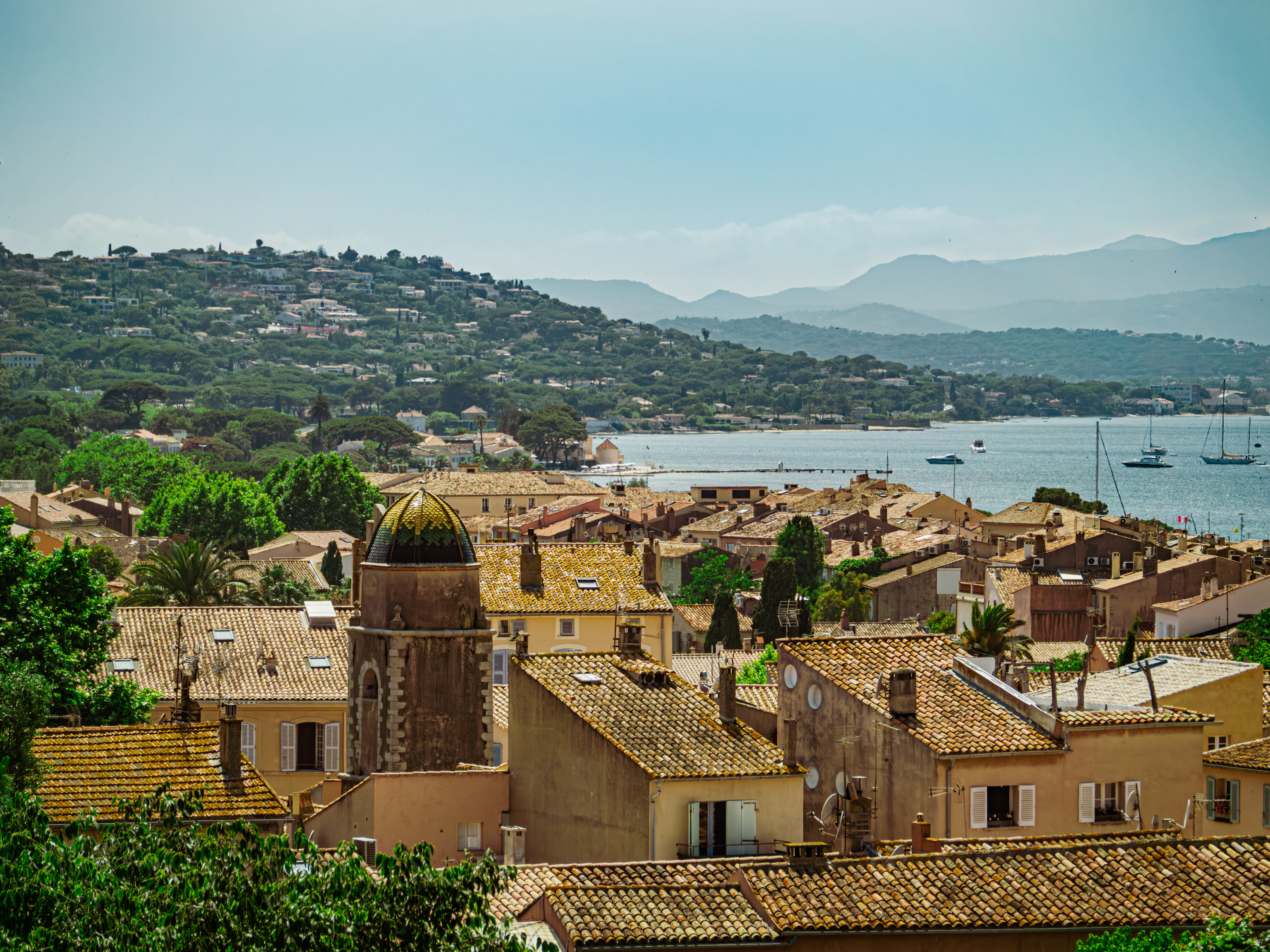 A coastal town with buildings and a bay.